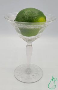 Lime in crystal wine glass