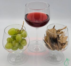 tannin cover photo with grapes, wood, and wine